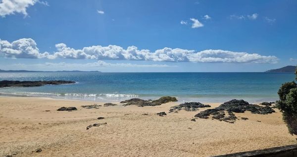 Cable Bay pink golden sand beach